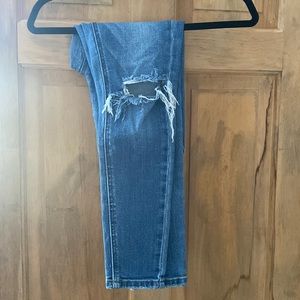 Tight blue skinny jeans with rips